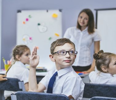 Beautiful children are students together in a classroom in school get the education with the teacher