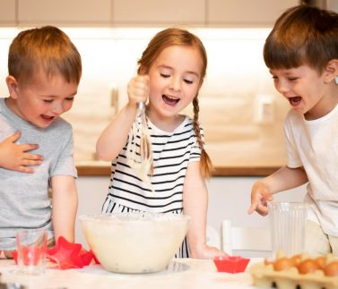 front-view-siblings-cooking-home